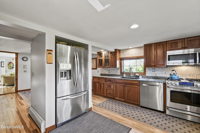 288 Johnson Rd, Dalton, MA 01226 - kitchen with appliances with stainless steel finishes, a sink, light wood finished floors, tasteful backsplash, and recessed lighting