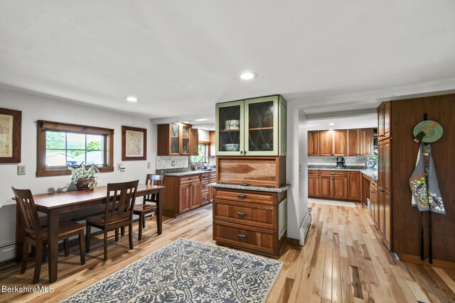 288 Johnson Rd, Dalton, MA 01226 - kitchen with decorative backsplash, light wood-style floors, recessed lighting, and glass insert cabinets