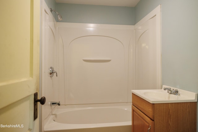 bathroom featuring bathtub / shower combination and vanity