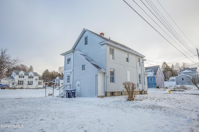 view of snow covered house