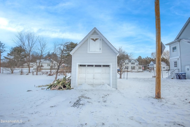 view of snow covered garage