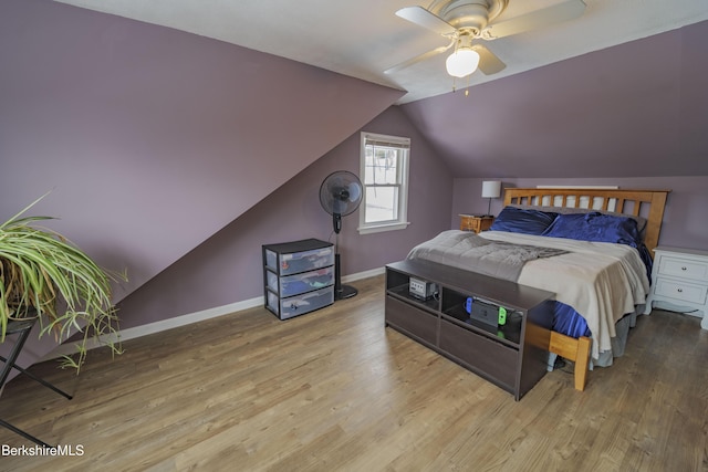 bedroom featuring vaulted ceiling, light hardwood / wood-style flooring, and ceiling fan