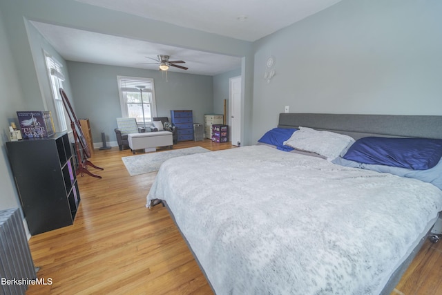 bedroom featuring wood-type flooring and ceiling fan