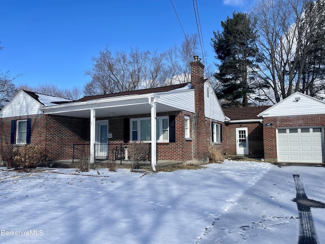 view of front facade with a garage and covered porch