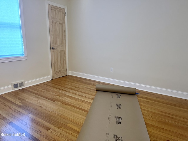 spare room featuring light hardwood / wood-style flooring