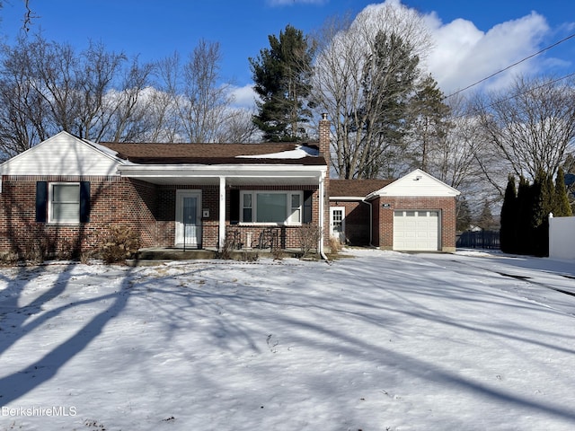 view of front of house featuring a garage and a porch