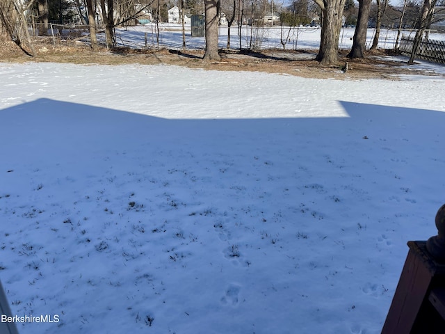 view of yard layered in snow