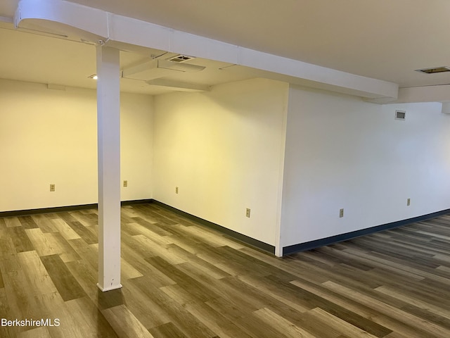 basement with wood-type flooring