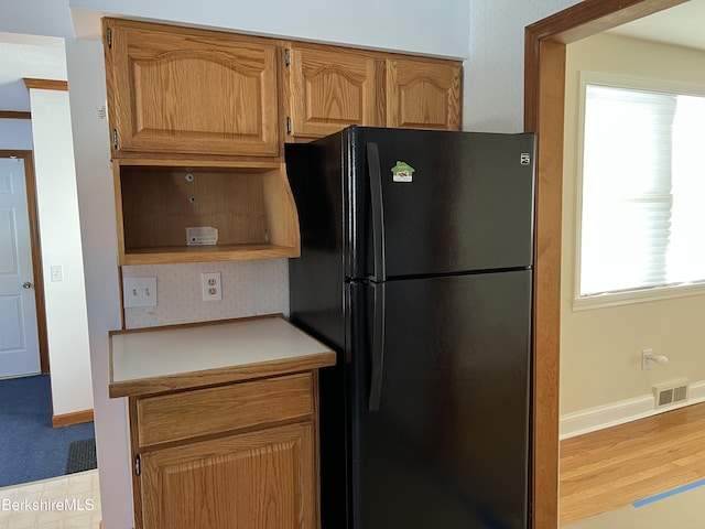 kitchen with black refrigerator