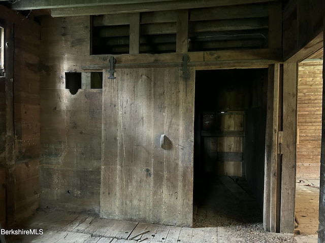 interior space featuring a barn door