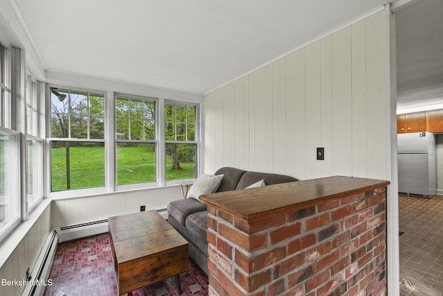 living room with brick patterned flooring, baseboard heating, ornamental molding, and wood walls
