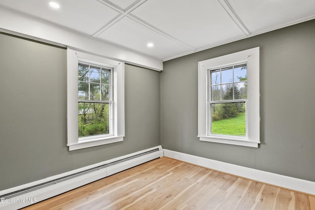 unfurnished room featuring a baseboard radiator, plenty of natural light, wood finished floors, baseboards, and recessed lighting