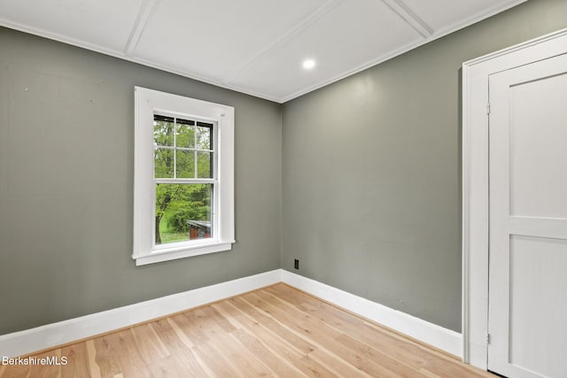 empty room featuring baseboards, wood finished floors, and recessed lighting