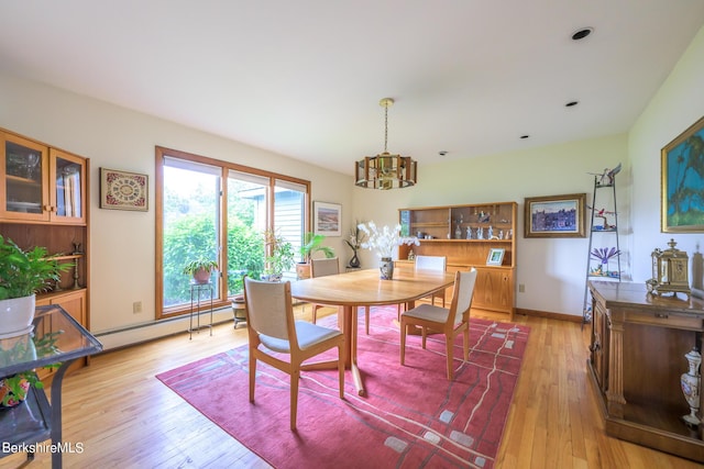 26 Filomena Dr, Pittsfield, MA 01201 - dining space featuring a baseboard radiator, a chandelier, and light wood-type flooring