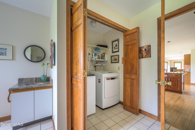 26 Filomena Dr, Pittsfield, MA 01201 - washroom with washer and clothes dryer and light tile patterned flooring