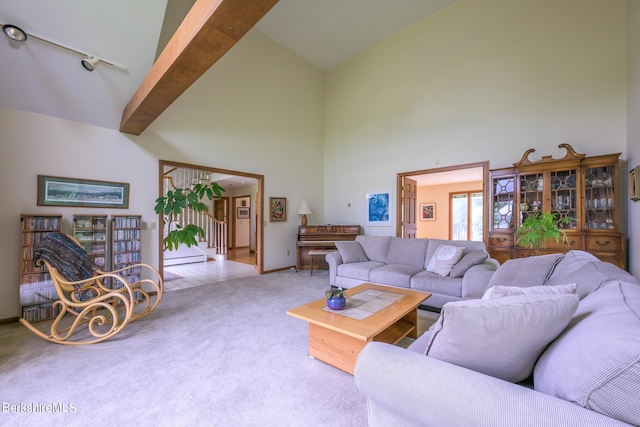 26 Filomena Dr, Pittsfield, MA 01201 - carpeted living room featuring high vaulted ceiling and baseboards