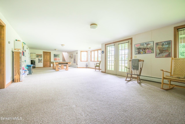 26 Filomena Dr, Pittsfield, MA 01201 - living area with french doors, light carpet, and stairway