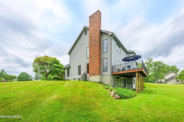 26 Filomena Dr, Pittsfield, MA 01201 - rear view of property with a deck, a chimney, and a yard