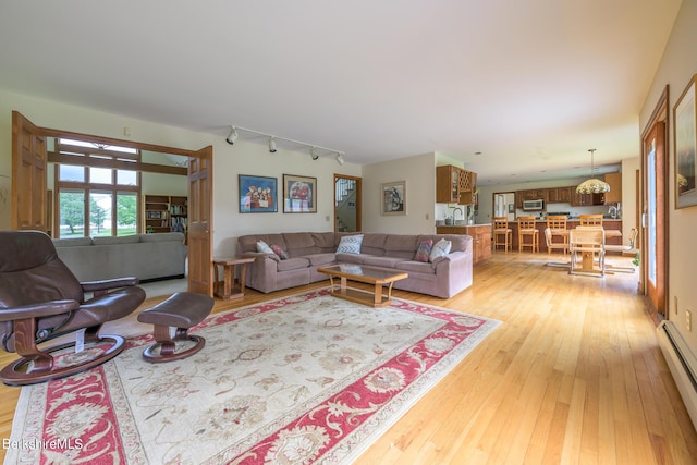 26 Filomena Dr, Pittsfield, MA 01201 - living area featuring light wood-type flooring, a baseboard radiator, and track lighting