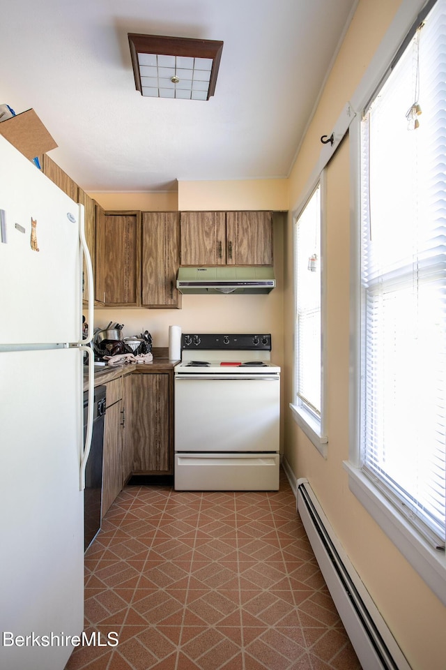 567 S Main St, Sheffield, MA 01257 - kitchen with white appliances, a baseboard radiator, under cabinet range hood, and healthy amount of natural light