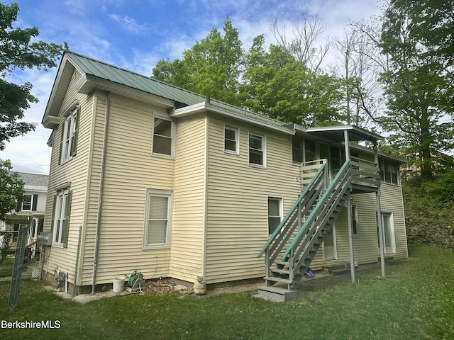 21 Goodrich St, Pittsfield, MA 01201 - back of house featuring stairway, a lawn, and metal roof