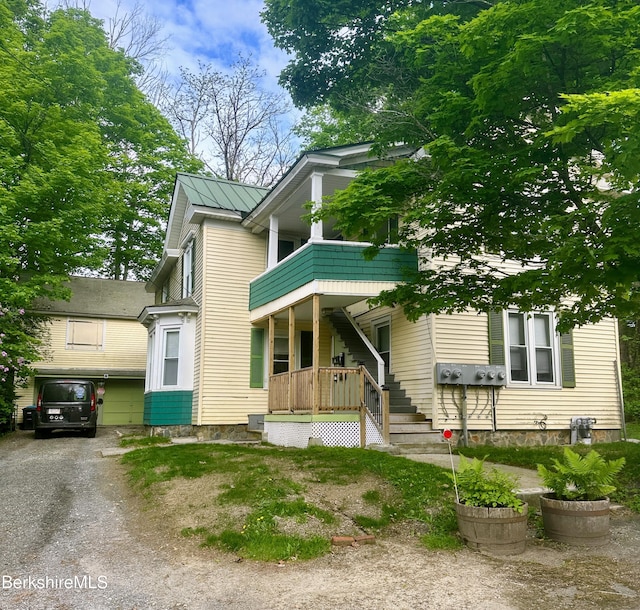 21 Goodrich St, Pittsfield, MA 01201 - view of front of home with covered porch and a balcony