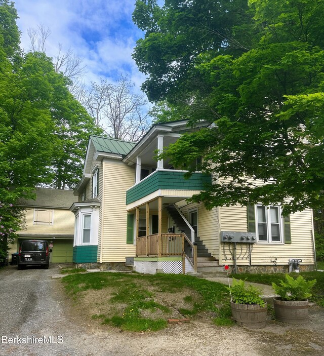 21 Goodrich St, Pittsfield, MA 01201 - view of front of house featuring a porch and a balcony