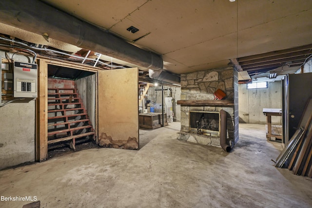 40 Silver St, Lanesborough, MA 01237 - below grade area with electric panel, stairs, a fireplace, and water heater