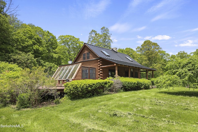 40 Silver St, Lanesborough, MA 01237 - view of side of property featuring a chimney, log exterior, a lawn, and metal roof