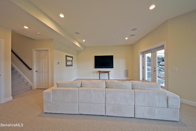 living area featuring recessed lighting, carpet floors, baseboards, and stairs