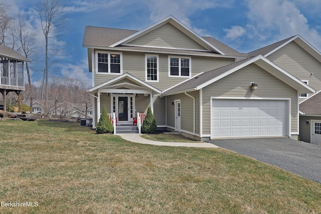 view of front facade featuring aphalt driveway, a shingled roof, central AC, an attached garage, and a front yard