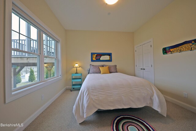 bedroom with carpet and baseboards