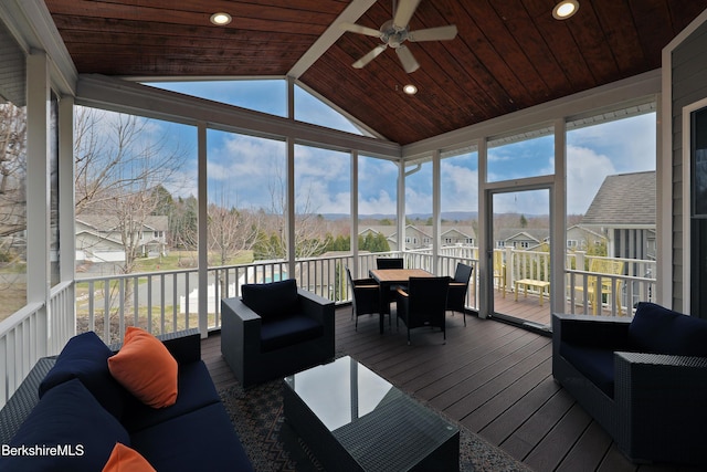 sunroom with outdoor dining space, a residential view, ceiling fan, and an outdoor hangout area