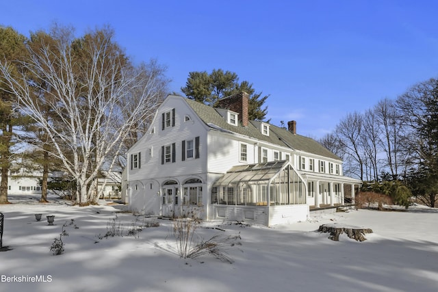 view of snow covered house