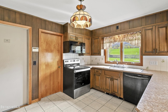 75 E Rd, Adams, MA 01220 - kitchen with light tile patterned floors, a sink, black appliances, light countertops, and tasteful backsplash