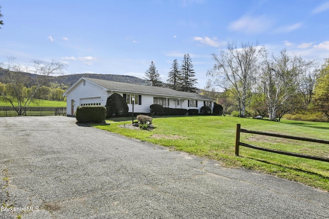 75 E Rd, Adams, MA 01220 - ranch-style house with a garage, fence, driveway, and a front yard