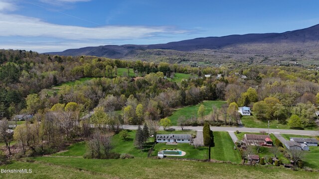 75 E Rd, Adams, MA 01220 - view of property location featuring a mountainous background and a heavily wooded area