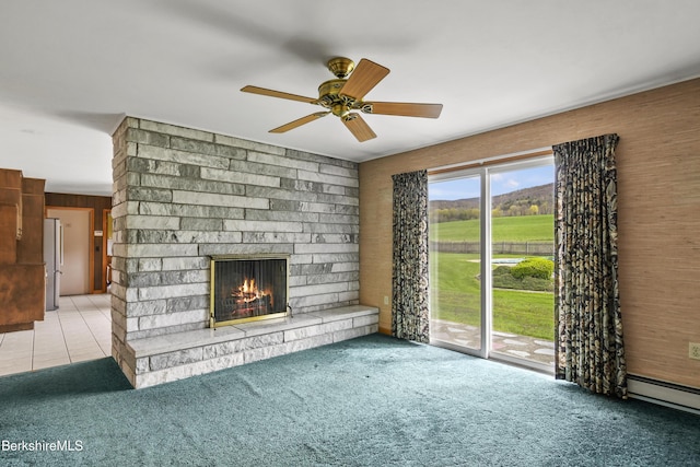 75 E Rd, Adams, MA 01220 - unfurnished living room featuring a brick fireplace, ceiling fan, a baseboard heating unit, and carpet
