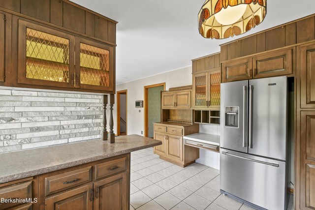 75 E Rd, Adams, MA 01220 - kitchen with glass insert cabinets, high quality fridge, decorative backsplash, and light tile patterned flooring