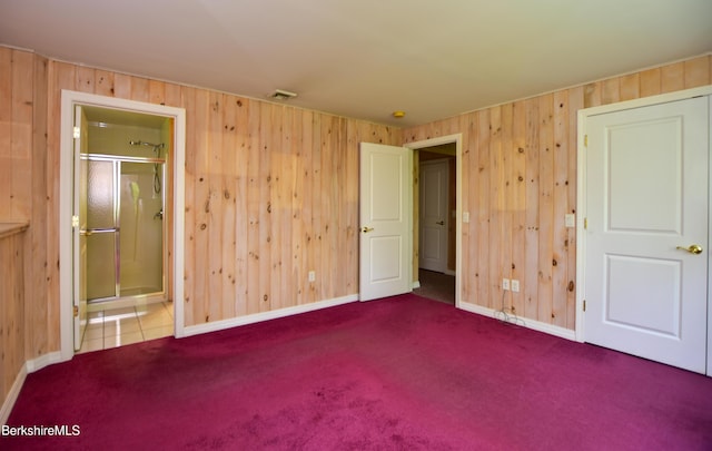 232 Harrington Rd, Otis, MA 01253 - unfurnished bedroom with carpet, wooden walls, baseboards, and ensuite bath