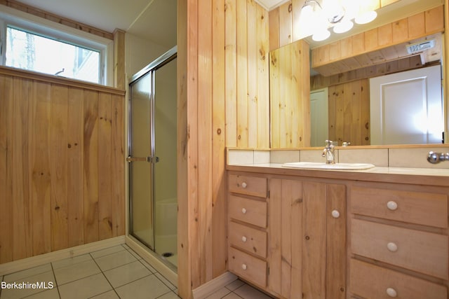 232 Harrington Rd, Otis, MA 01253 - full bathroom featuring a shower stall, tile patterned floors, wood walls, and vanity