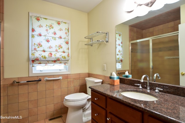 232 Harrington Rd, Otis, MA 01253 - full bathroom featuring tile walls, a shower stall, a wainscoted wall, tile patterned flooring, and toilet