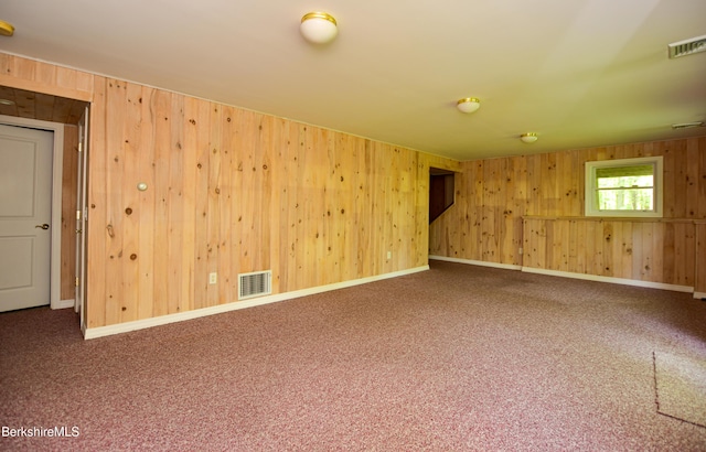 232 Harrington Rd, Otis, MA 01253 - unfurnished room with wooden walls, carpet, and baseboards