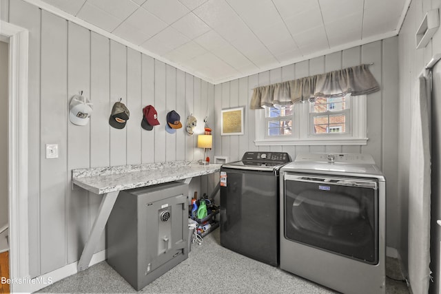 laundry room featuring washing machine and clothes dryer and laundry area