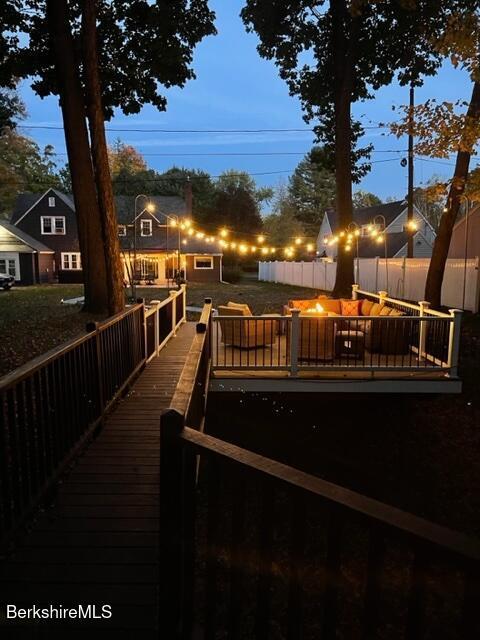 wooden deck featuring fence