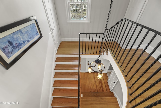 stairs with wood finished floors