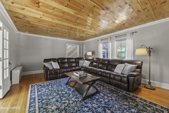 living area with baseboards, stairway, ornamental molding, wooden ceiling, and wood-type flooring