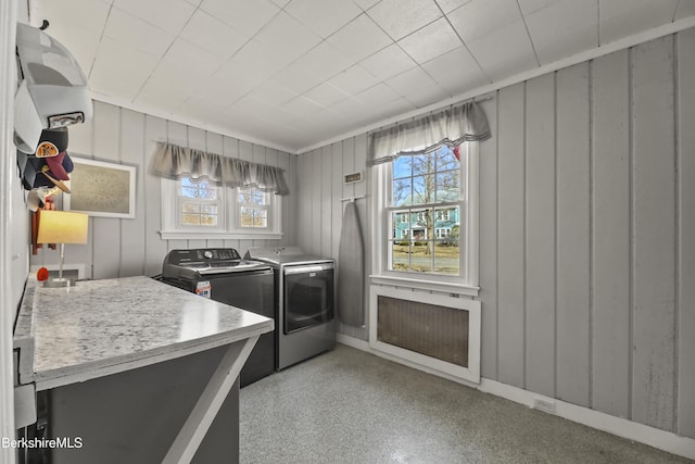 laundry room with laundry area, plenty of natural light, and washing machine and dryer