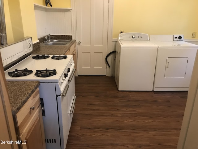 kitchen featuring dark hardwood / wood-style floors, white cabinetry, sink, independent washer and dryer, and white gas stove