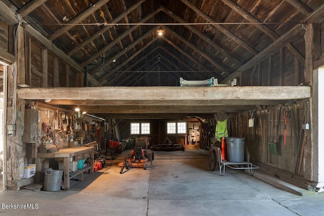 miscellaneous room featuring high vaulted ceiling